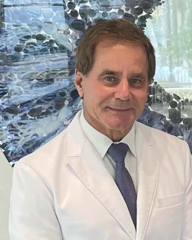 Dr. Joseph C. Gretzula in his white coat